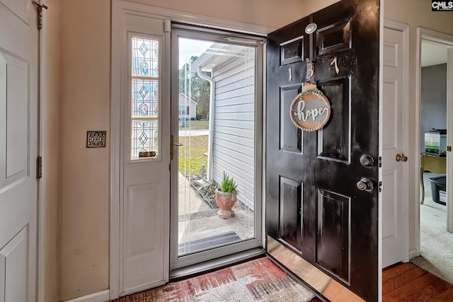 doorway to outside with hardwood / wood-style flooring