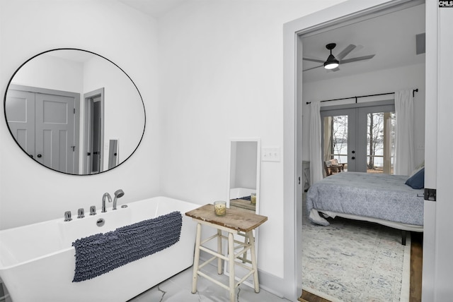 bathroom featuring french doors and ceiling fan