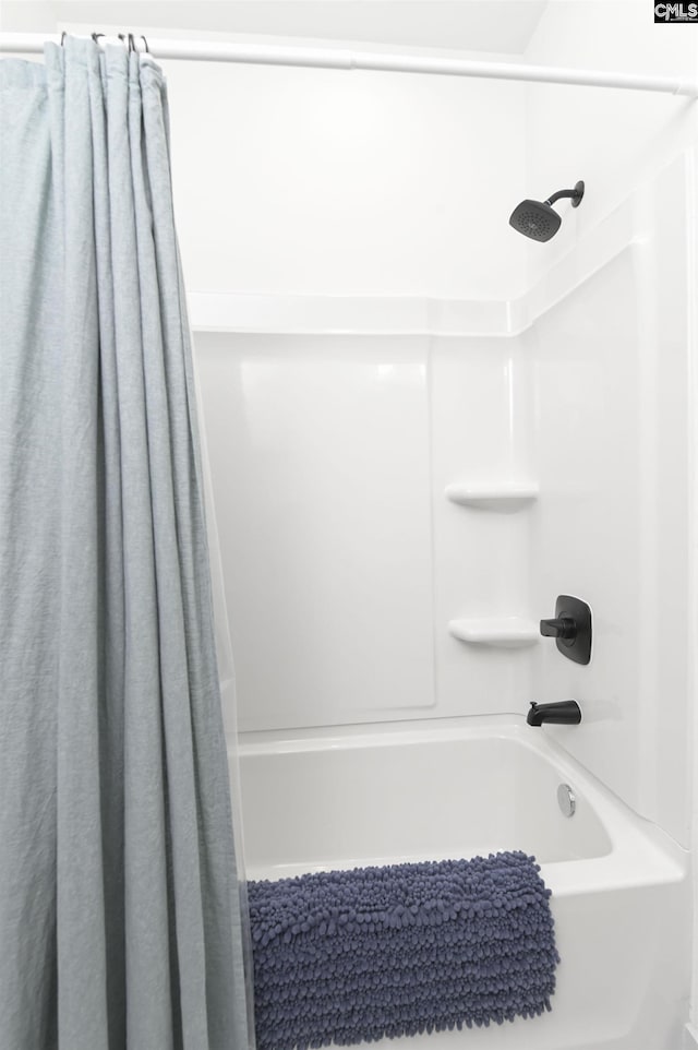 bathroom with shower / bath combination with curtain