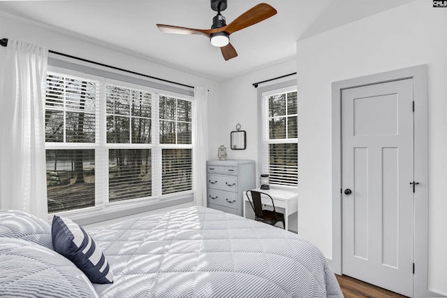 bedroom with ceiling fan and wood-type flooring