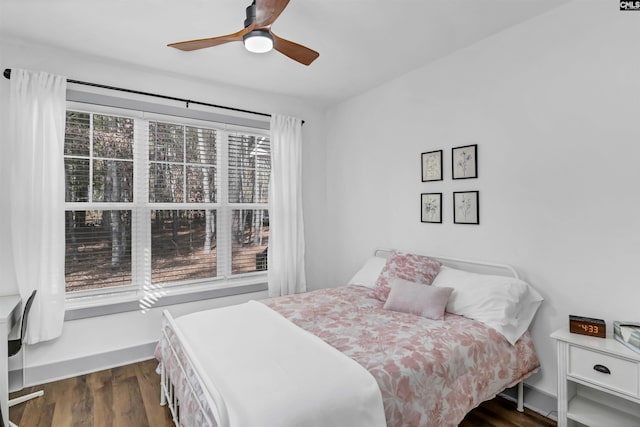 bedroom featuring ceiling fan and dark hardwood / wood-style floors