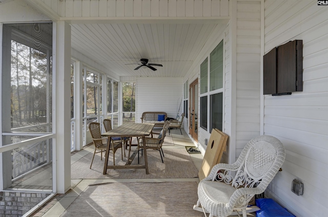 sunroom / solarium with ceiling fan and a healthy amount of sunlight