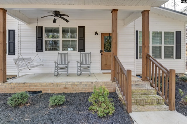 entrance to property featuring ceiling fan and a porch