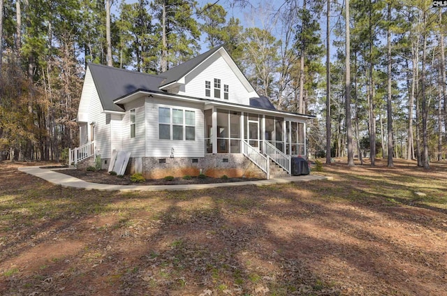 view of front facade featuring a sunroom