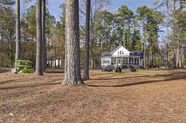 view of yard with a sunroom