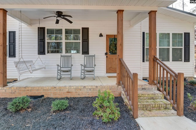 doorway to property with a porch and ceiling fan