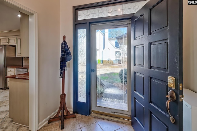 entryway featuring light tile patterned flooring