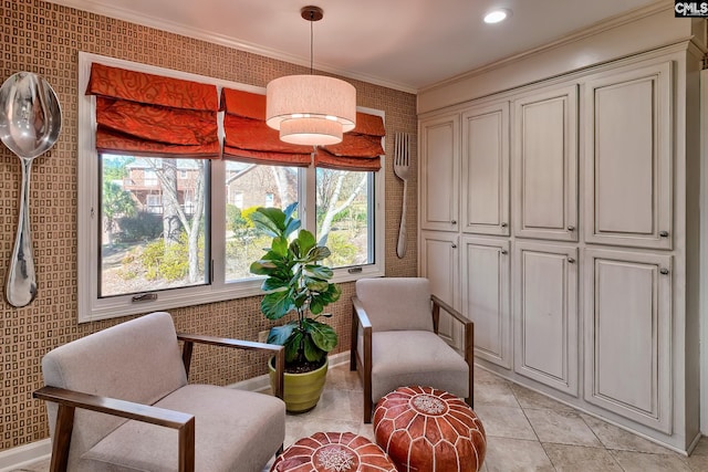 living area with brick wall, ornamental molding, and light tile patterned floors