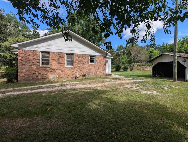 view of property exterior featuring a lawn and an outbuilding