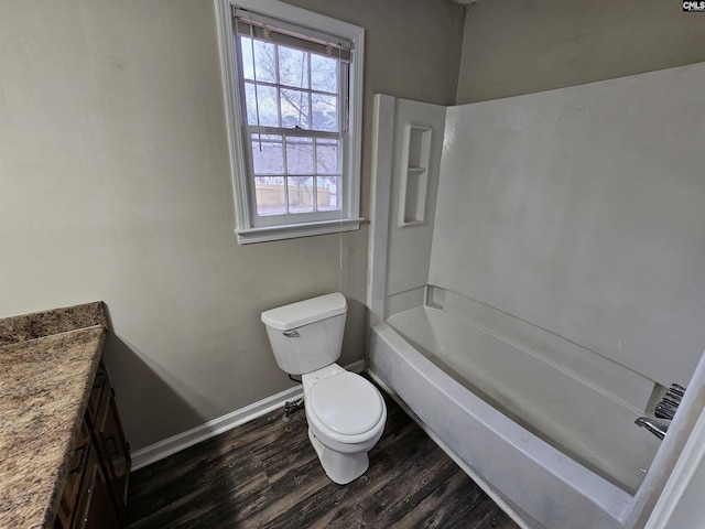 bathroom with hardwood / wood-style flooring, vanity, and toilet