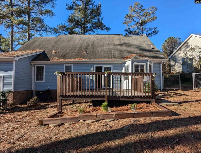 back of property featuring a wooden deck