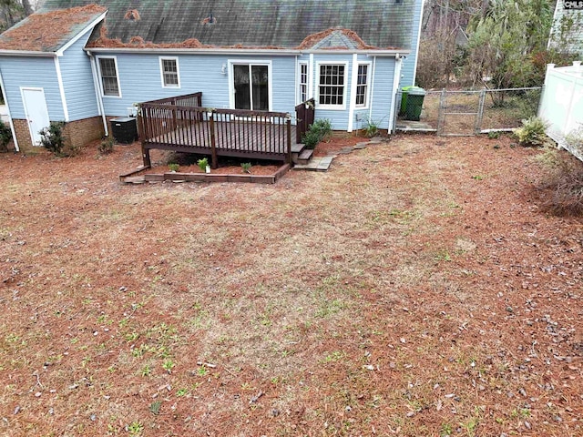 rear view of house featuring a deck