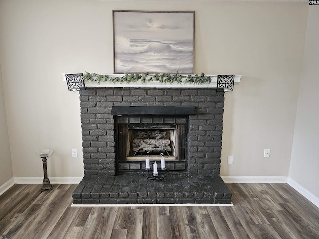 room details featuring hardwood / wood-style floors and a brick fireplace