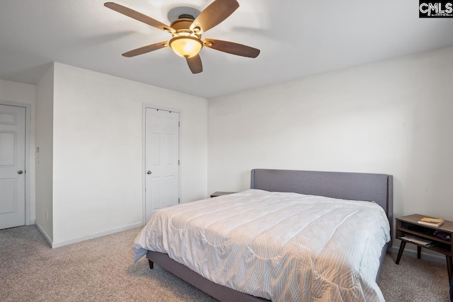 bedroom with ceiling fan and light carpet