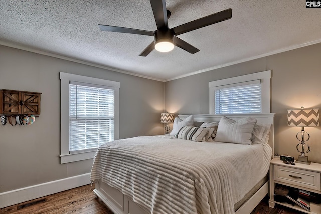 bedroom featuring crown molding, a textured ceiling, and ceiling fan