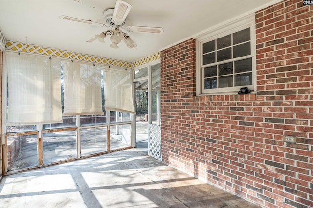 interior space with ceiling fan