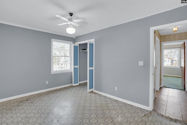 unfurnished room with ceiling fan