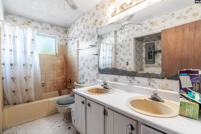 full bathroom with toilet, a textured ceiling, vanity, shower / bath combo, and ceiling fan