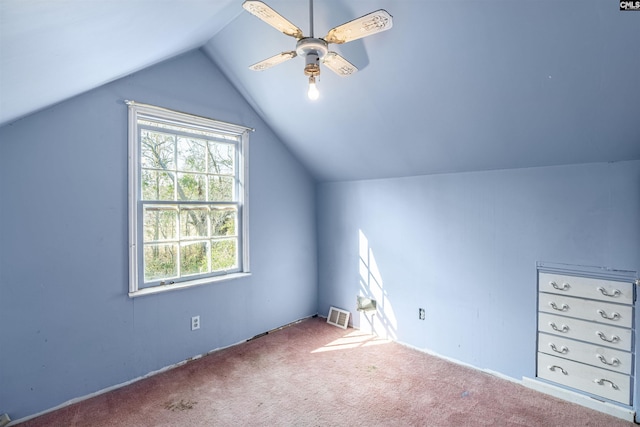 additional living space with vaulted ceiling, ceiling fan, and carpet