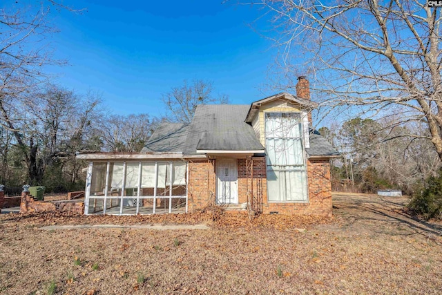 view of front facade featuring a sunroom