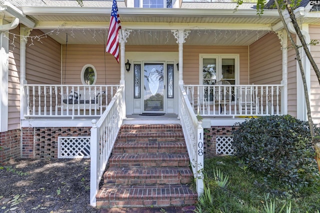 entrance to property featuring covered porch