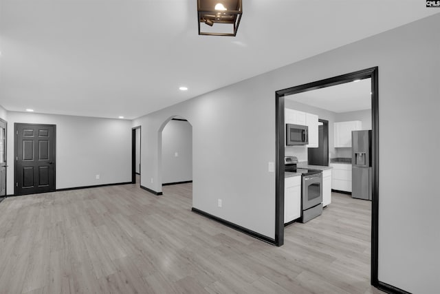 unfurnished living room with light hardwood / wood-style floors