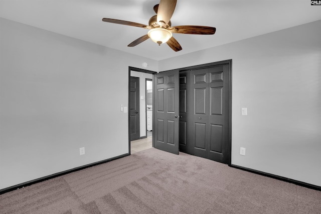 unfurnished bedroom with ceiling fan, light colored carpet, and a closet