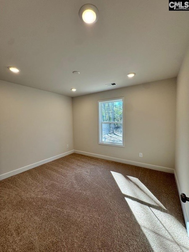 spare room with carpet flooring