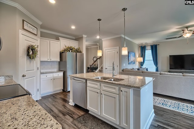 kitchen featuring sink, dark wood-type flooring, tasteful backsplash, stainless steel dishwasher, and white cabinets