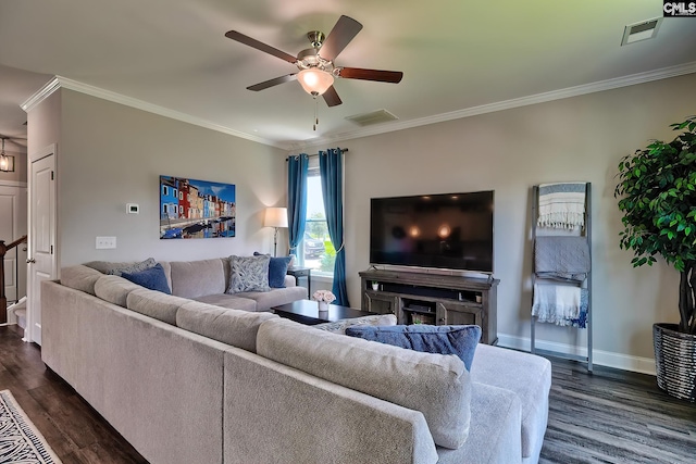 living room with ceiling fan, ornamental molding, and dark wood-type flooring