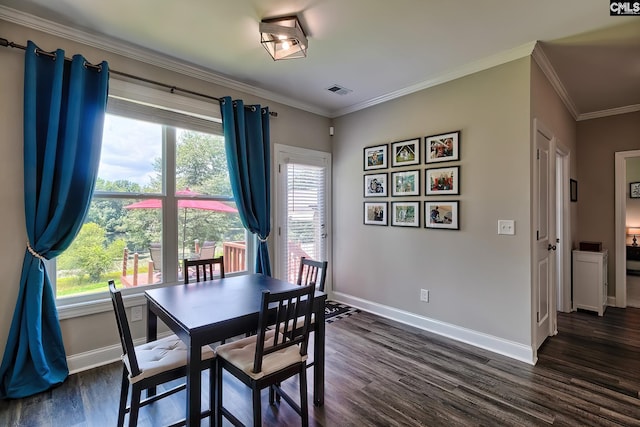 dining area featuring dark hardwood / wood-style flooring and ornamental molding