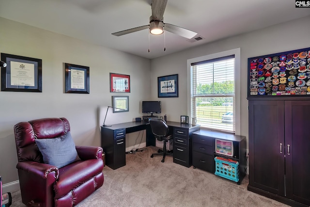 office space with light carpet and ceiling fan