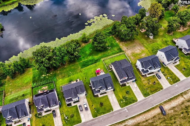 birds eye view of property with a water view