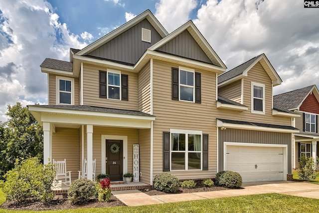 craftsman inspired home featuring a porch and a garage