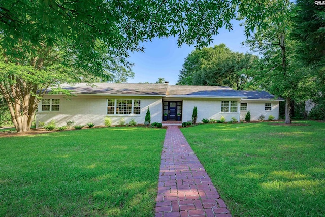 ranch-style home featuring a front yard