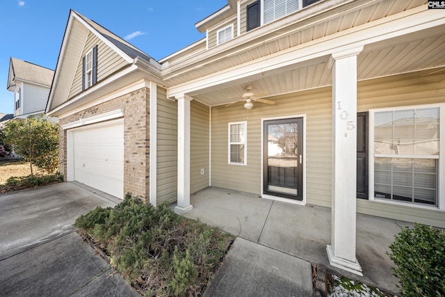 property entrance with ceiling fan, covered porch, and a garage