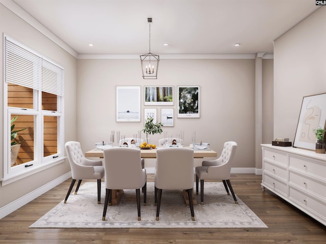 dining room featuring ornamental molding, a notable chandelier, dark wood-type flooring, and a healthy amount of sunlight