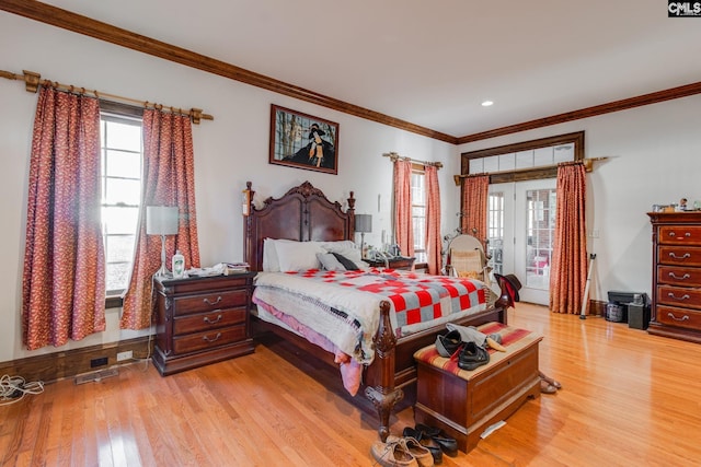 bedroom featuring light hardwood / wood-style flooring and ornamental molding