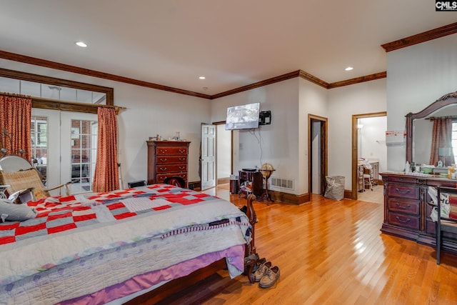 bedroom with ornamental molding and light wood-type flooring