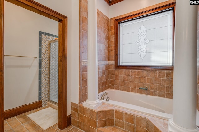 bathroom featuring tile patterned floors, ornate columns, and independent shower and bath