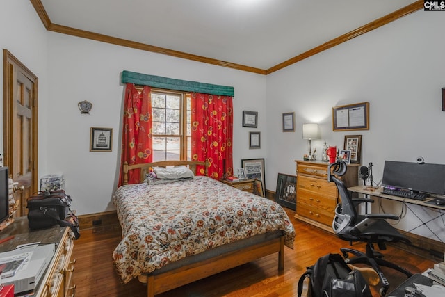 bedroom featuring dark hardwood / wood-style floors and ornamental molding