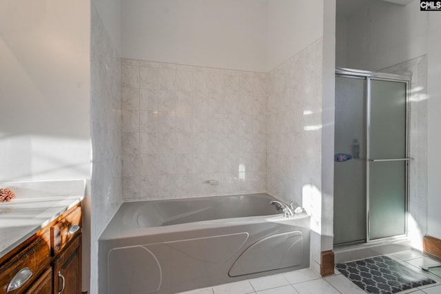 bathroom featuring tile patterned flooring, vanity, and independent shower and bath