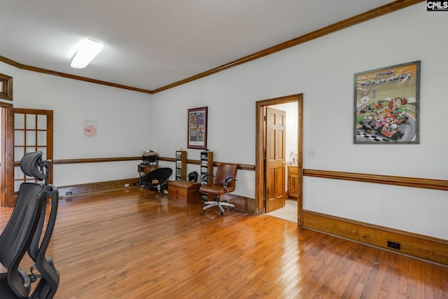 office area featuring ornamental molding and light wood-type flooring