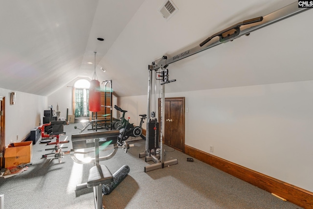 workout area with carpet and vaulted ceiling