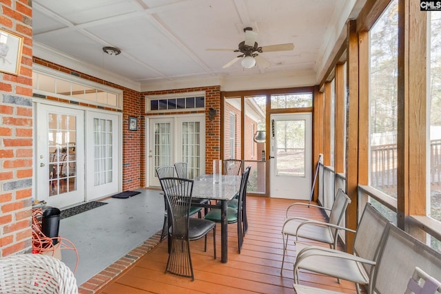 sunroom / solarium with ceiling fan and coffered ceiling