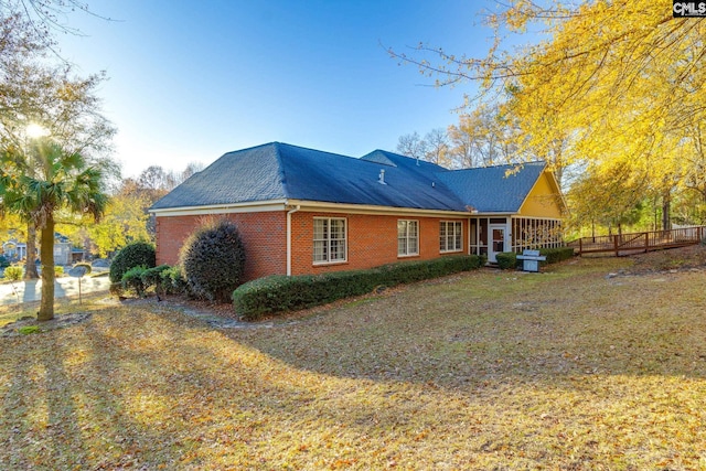 view of home's exterior featuring a yard