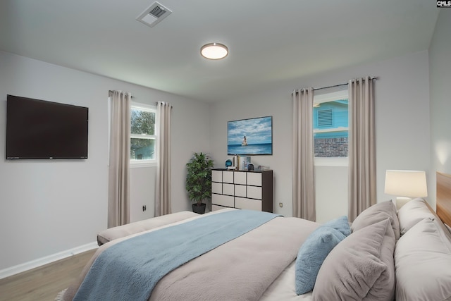 bedroom featuring wood-type flooring