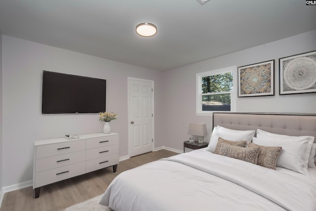 bedroom with light wood-type flooring