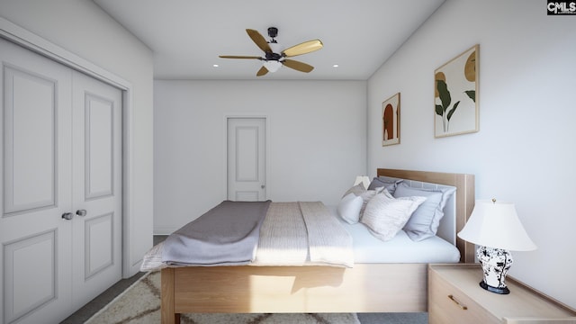 bedroom with ceiling fan and a closet