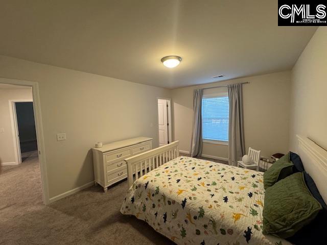 bedroom featuring carpet